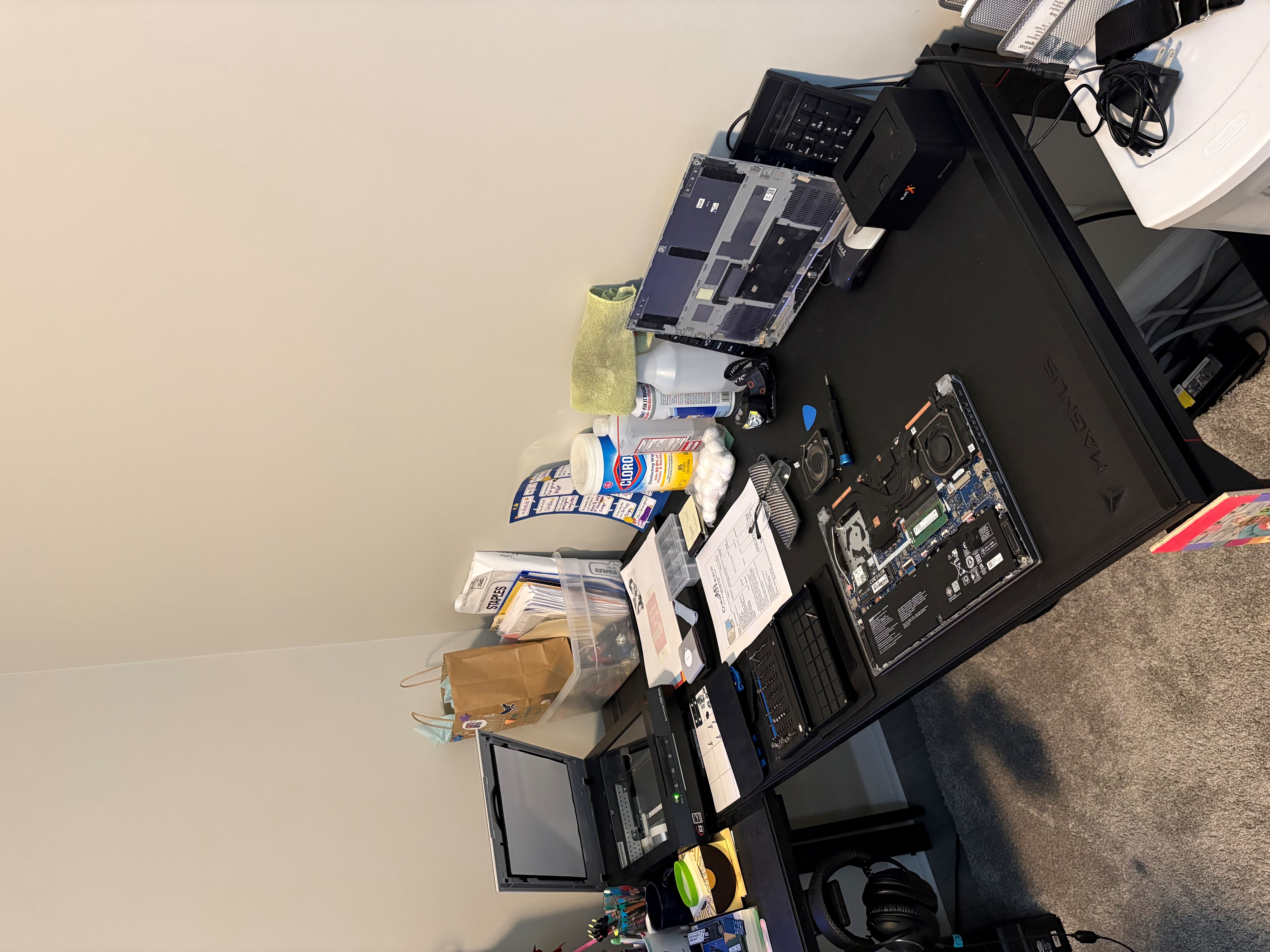 Laptop repair in progress on the JMG Computers workbench